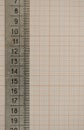 Ruler made from metal lie on a graph paper with copy space for text. Math graphic tools concept Royalty Free Stock Photo