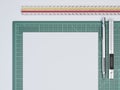 Ruler and paper sheet on green cutting mat. 3d rendering Royalty Free Stock Photo