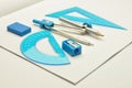 Rulers, compasses, eraser with sharpener for noteb Royalty Free Stock Photo