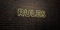 RULES -Realistic Neon Sign on Brick Wall background - 3D rendered royalty free stock image