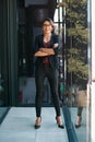 Ruling the business world. Full length portrait of an attractive young businesswoman standing alone with her arms folded Royalty Free Stock Photo