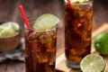 Rum and cola cocktail with lime slice in tall glasses Royalty Free Stock Photo