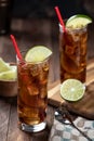 Rum and cola cocktail with lime slice in tall glasses Royalty Free Stock Photo