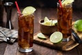 Rum and cola cocktail with lime slice in tall glasses Royalty Free Stock Photo