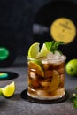 Rum and cola, Cuba Libre drink with lime and ice. Cuba Libre or long island iced tea cocktail with strong drinks on dark Royalty Free Stock Photo