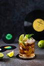 Rum and cola, Cuba Libre drink with lime and ice. Cuba Libre or long island iced tea cocktail with strong drinks on dark Royalty Free Stock Photo