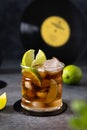 Rum and cola, Cuba Libre drink with lime and ice. Cuba Libre or long island iced tea cocktail with strong drinks on dark Royalty Free Stock Photo