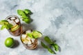 Rum and cola. Cuba Libre drink with lime and ice on rustic concrete table Royalty Free Stock Photo