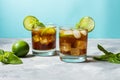 Rum and cola. Cuba Libre drink with lime and ice on rustic concrete table Royalty Free Stock Photo