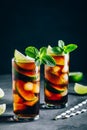 Rum and Cola Cuba Libre ice cold drink cocktail with lime and mint Royalty Free Stock Photo