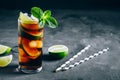 Rum and Cola Cuba Libre ice cold drink cocktail with lime and mint Royalty Free Stock Photo