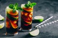 Rum and Cola Cuba Libre ice cold drink cocktail with lime and mint Royalty Free Stock Photo