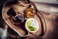 Rum with ice and coconut, a bottle of rum with lime Royalty Free Stock Photo