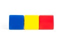 Rumania flag colors: blue, yellow, red in the form of children`s cubes.