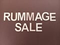 Rummage sale sign on a brown background Royalty Free Stock Photo