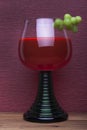 Rummer wine glass with green grapes