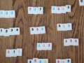 Rummikub tiles on wooden table Royalty Free Stock Photo