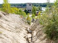 The Rummu quarry is a submerged limestone quarry located in Rummu, Estonia. Much of the natural area of the quarry is under a lake