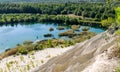The Rummu quarry is a submerged limestone quarry located in Rummu, Estonia. Much of the natural area of the quarry is under a lake