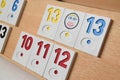 Rummy game formations arranged on the board in selective focus. Wooden board with sets of numbers Royalty Free Stock Photo