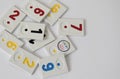 Rummy pieces randomly mixed on a white background. Free space for text. Rummy society boardgame