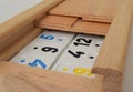Rummy wooden box with playing pieces inside. Ready to play Royalty Free Stock Photo