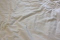 ÃÂ¡rumpled bed sheets with white messy linen top view