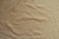 Rumpled beige jersey fabric from above