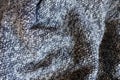 Rumpled blue grey melange woolen fabric