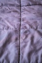 Rumpled brown quilt textile background