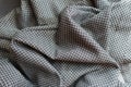 Rumpled grey viscose fabric with geometric print