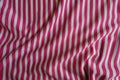 Rumpled striped fabric in pink and white