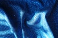 Rumpled shiny electric blue lurex fabric Royalty Free Stock Photo