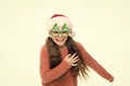 Run away. Christmas holiday. Small girl in santa hat. Having fun. Happy child christmas tree eyewear accessory booth