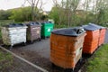 Run down looking wheelie bins at a recycling point