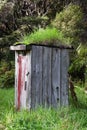Run down outhouse