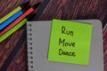 Run Move Dance text on sticky notes with office desk