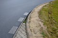 Run-over edges with tracks from heavy trucks. a poorly designed turn radius means damage to curbs, concrete paving. damaged lawn d Royalty Free Stock Photo