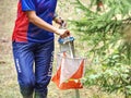 Run people in forest checking chip with control point