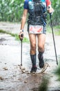 Run rain,Cross country runner,Trail running in the forest,uphill in autumn trail of mud and stones,In the north of Thailand,blur,S Royalty Free Stock Photo