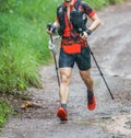 Run rain,Cross country runner,Trail running in the forest,uphill in autumn trail of mud and stones,In the north of Thailand,blur,S Royalty Free Stock Photo