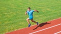Run into shape. Running challenge for beginners. Athlete run track grass background. Sprinter training at stadium track