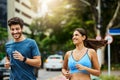 Run with your whole heart. a sporty young couple exercising together outdoors. Royalty Free Stock Photo