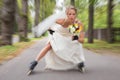 Runaway bride on roller skates Royalty Free Stock Photo