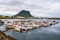Rundarfjordur town as seen from the port. Jetty and boats are at foreground and famous Kirkjufell mountain is at background