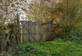 A rundown rickety wooden gate in the countryside