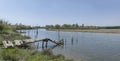 rundown wooden pier on Quaranta canal banks, near Cona island conservation area, Staranzano, Friuli, Italy