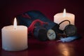 Bag with runes and rune Gebo on the background of burning candles with bokeh.