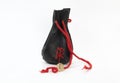 Rune Laguz from ash, an old leather bag for Scandinavian runes Royalty Free Stock Photo