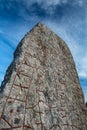 Rune stone and a dramatic sky